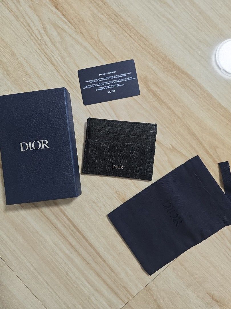 Authentic Dior Oblique lack Card Holder (Category: Luxury Bags & Wallets) located in Cainta. Submitted by dikonaneed (Listing ID 1467201186, Image 1). Description: - Authentic Black Dior card holder bought in dior thailand - Combines premium grained leather with signature Oblique jacquard canvas - Features multiple card slots on one side - Comes complete with original box and dust bag - Condition: Excellent - Mode of Payment: GCash, BPI, or Bank 