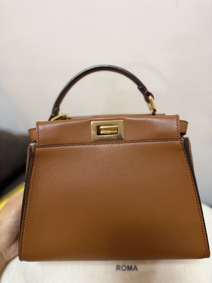 Authentic Fendi Peekaboo Mini Brown (Category: Luxury Bags & Wallets) located in Cavite. Submitted by trueluxury_boutique (Listing ID 1466778463, Image 3). Description: - Guaranteed Authentic Fendi Peekaboo Mini in luxurious brown sellier leather - Features a chic raffia-effect partition with raised FF motif and gold-finish hardware - Compact yet practical size: 23 x 18 x 11 cm (fits 6.7" smartphone, wallet, and keys) - Tone-on-tone nappa leather