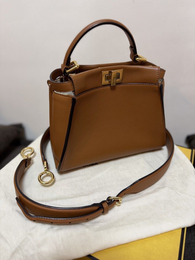 Authentic Fendi Peekaboo Mini Brown (Category: Luxury Bags & Wallets) located in Cavite. Submitted by trueluxury_boutique (Listing ID 1466778463, Image 1). Description: - Guaranteed Authentic Fendi Peekaboo Mini in luxurious brown sellier leather - Features a chic raffia-effect partition with raised FF motif and gold-finish hardware - Compact yet practical size: 23 x 18 x 11 cm (fits 6.7" smartphone, wallet, and keys) - Tone-on-tone nappa leather