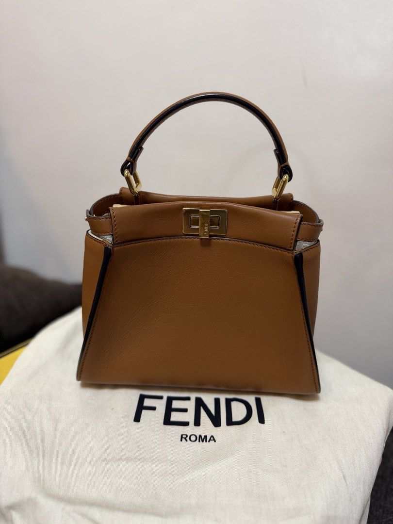 Authentic Fendi Peekaboo Mini Brown (Category: Luxury Bags & Wallets) located in Cavite. Submitted by trueluxury_boutique (Listing ID 1466778463, Image 2). Description: - Guaranteed Authentic Fendi Peekaboo Mini in luxurious brown sellier leather - Features a chic raffia-effect partition with raised FF motif and gold-finish hardware - Compact yet practical size: 23 x 18 x 11 cm (fits 6.7" smartphone, wallet, and keys) - Tone-on-tone nappa leather