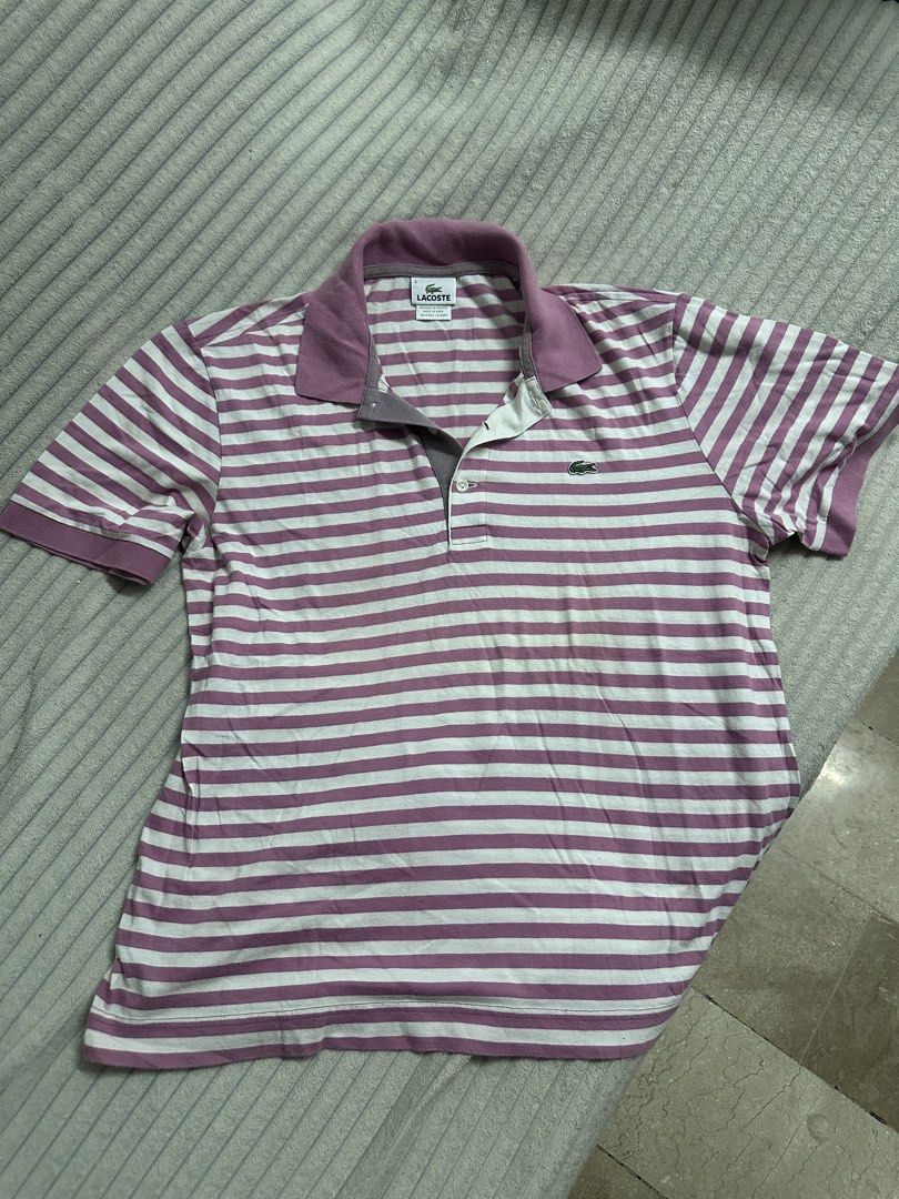 Authentic Lacoste Pink Striped Polo Shirt Size 5 (Category: Tshirts & Polo Shirts ) located in Quezon City. Submitted by lovedbymari (Listing ID 1467284367, Image 1). Description: - Authentic Lacoste striped polo shirt in pink and white - Size: 5 (tag on collar) - Classic collar neck with a 3-button placket - Iconic embroidered crocodile logo on the chest - Soft and comfortable cotton knit material - Designed in France, made in Peru.