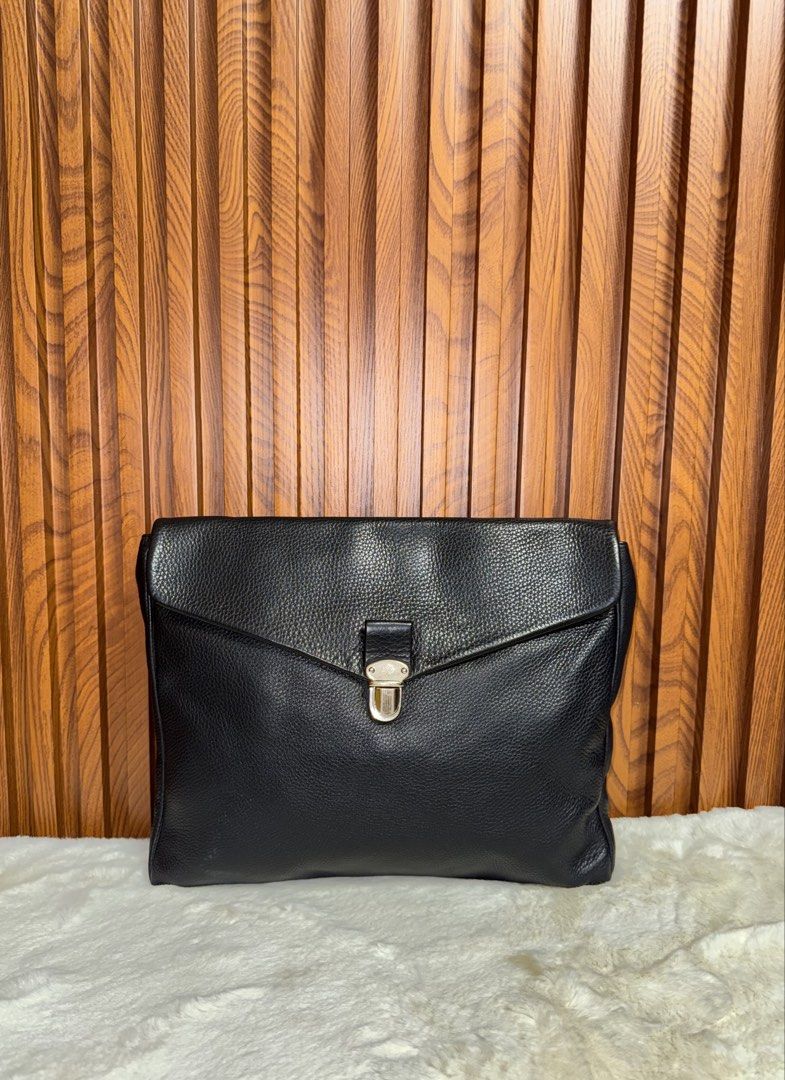 Authentic Mulberry Black Leather Envelope Clutch Bag (Category: Luxury Bags & Wallets) located in Subic. Submitted by luxshoppe88 (Listing ID 1467192260, Image 1). Description: - Authentic Mulberry clutch in premium black grained leather - Envelope flap closure with secure silver-tone metal turnlock - Clean black fabric interior with a convenient slip pocket - Features signature Mulberry tree logo patch and fob - Sleek, minimalist design ideal fo