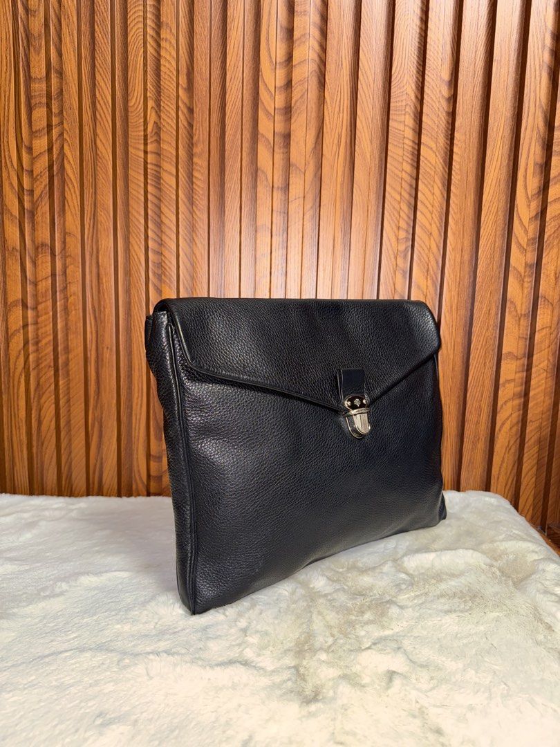 Authentic Mulberry Black Leather Envelope Clutch Bag (Category: Luxury Bags & Wallets) located in Subic. Submitted by luxshoppe88 (Listing ID 1467192260, Image 2). Description: - Authentic Mulberry clutch in premium black grained leather - Envelope flap closure with secure silver-tone metal turnlock - Clean black fabric interior with a convenient slip pocket - Features signature Mulberry tree logo patch and fob - Sleek, minimalist design ideal fo