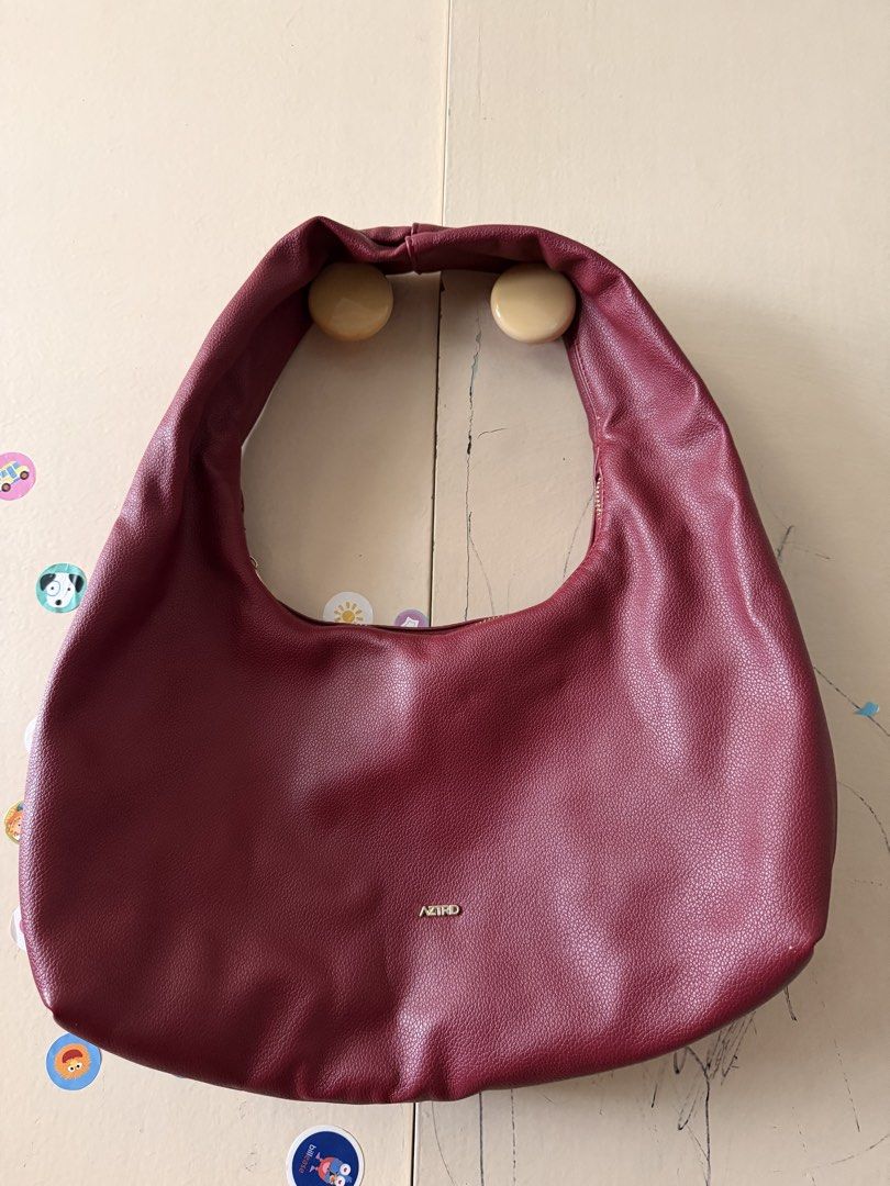 Aztrid Medium Shoulder Bag Burgundy Red (Category: Shoulder Bags) located in Pasay City. Submitted by ellen10131995 (Listing ID 1467231980, Image 3). Description: - Brand: Aztrid - Color: deep burgundy - Size: Medium (fits an iPad easily) - Material: Soft pebble-textured faux leather - Closure: Secure zip top - Hardware: Elegant gold-toned brand logo - Interior: Clean lining - Inclusion: Original black Aztrid storage box #bagforsale #bagsph.