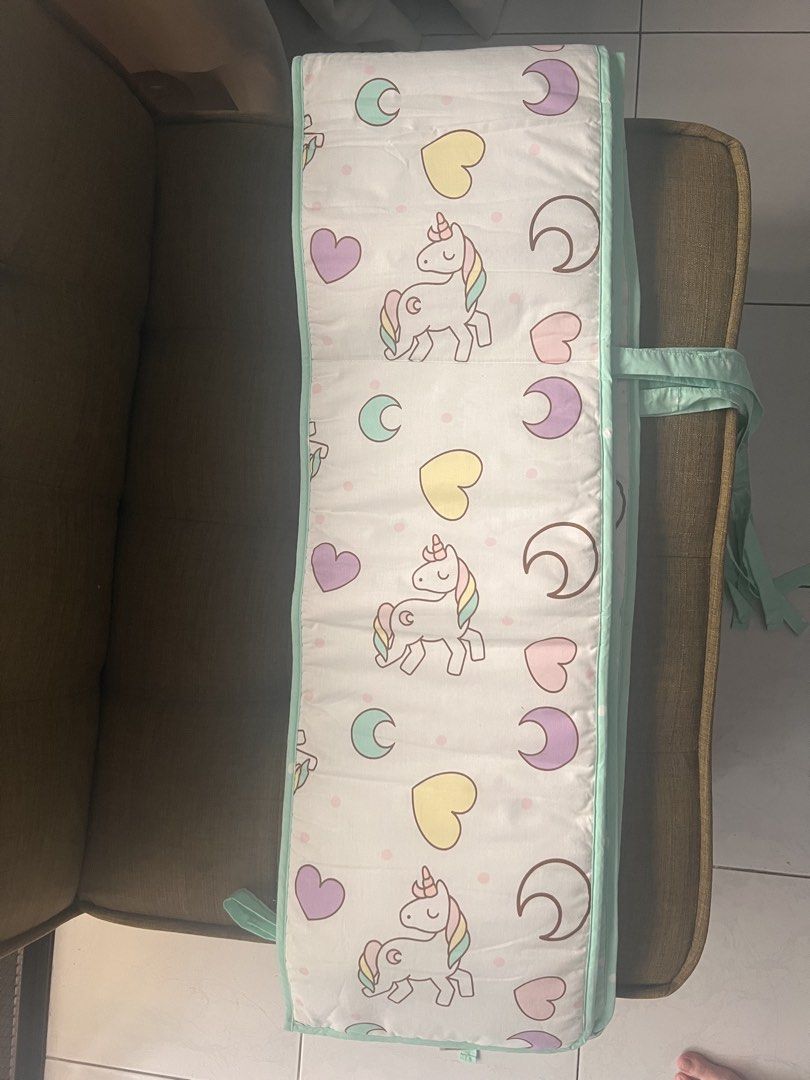 Baby Cot Bumper Unicorn Print Mint Green (Category: Cots & Cribs) located in Taguig. Submitted by miel77 (Listing ID 1467219559, Image 1). Description: - Adorable unicorn, moon, and heart print with stylish mint green trim - Soft fabric surface ensures a comfortable and safe environment for your baby - Convenient foldable panel design for easy storage and adjustment - Secure corner ties easily attach to standard crib bars - Perfect addition to yo