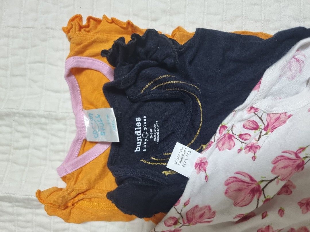 Baby Girl Bodysuits 3-6 Months Bundle Set (Category: Babies & Kids Fashion) located in Narvacan. Submitted by 2ndchancefinder (Listing ID 1467294734, Image 2). Description: - Size: 3-6 months - Material: 100% breathable cotton - Condition: Gently used, excellent quality - Quantity: Bundle of 3 adorable bodysuits - Design 1: White with sweet pink flower prints - Design 2: Black with printed necklace, handbag graphic, and bottom snap buttons - Desi