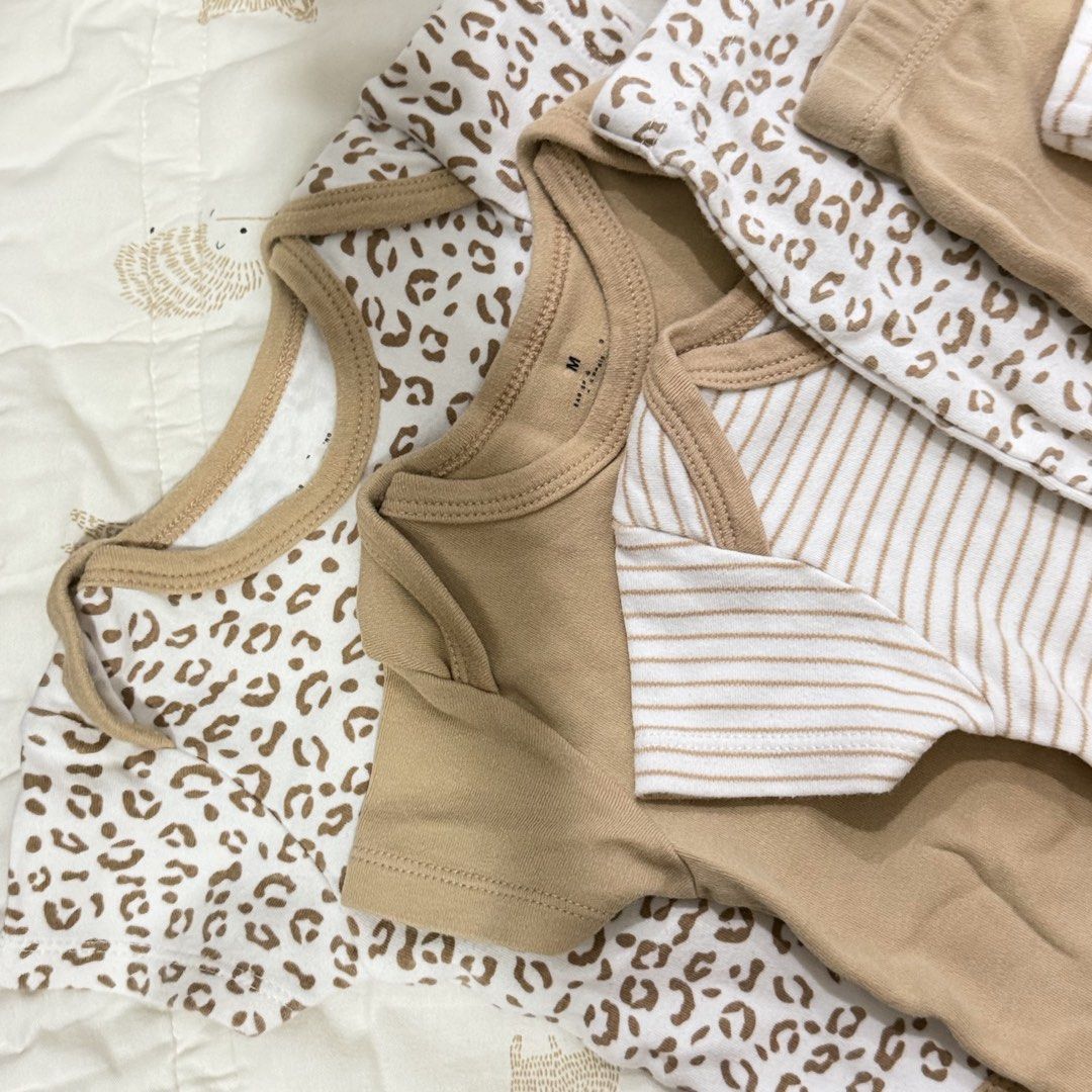 Baby neutral leopard and stripe bodysuits pants set size M (Category: Babies & Kids Fashion) located in Paranaque City. Submitted by yuffie__ (Listing ID 1467188109, Image 2). Description: - Adorable neutral beige and white baby outfit set - Size: M (tag visible on collar) - Includes 3 versatile short-sleeve bodysuits: leopard print, solid beige, and striped - Comes with matching comfortable leggings - Made from ultra-soft cotton fabric - Feature