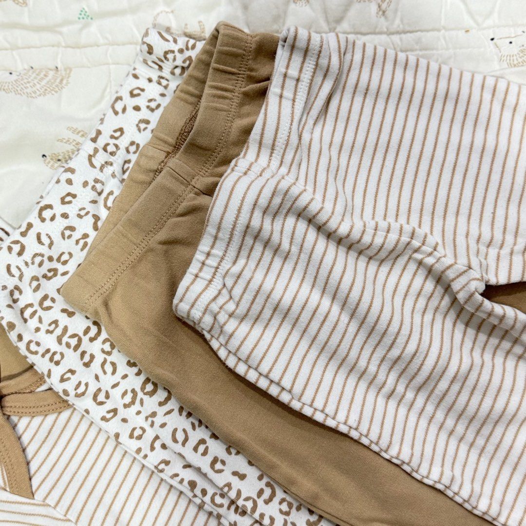 Baby neutral leopard and stripe bodysuits pants set size M (Category: Babies & Kids Fashion) located in Paranaque City. Submitted by yuffie__ (Listing ID 1467188109, Image 3). Description: - Adorable neutral beige and white baby outfit set - Size: M (tag visible on collar) - Includes 3 versatile short-sleeve bodysuits: leopard print, solid beige, and striped - Comes with matching comfortable leggings - Made from ultra-soft cotton fabric - Feature