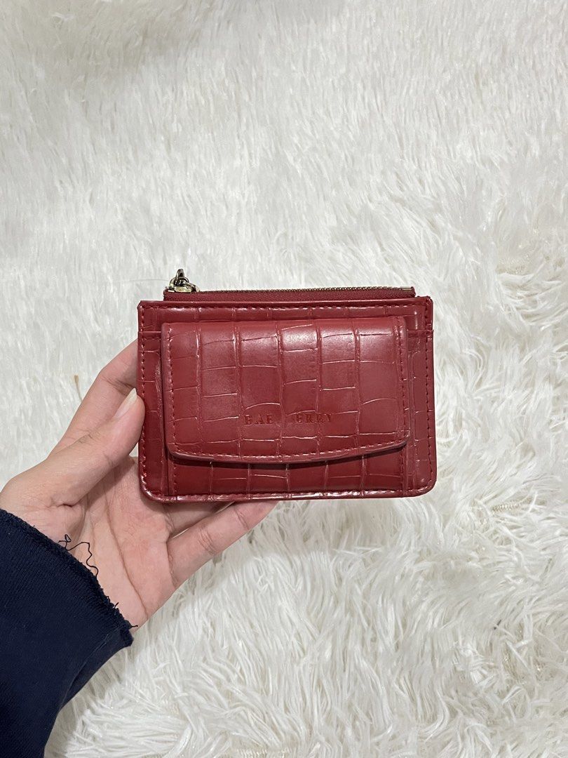 Baellery Red Crocodile Pattern Card Holder Wallet (Category: Wallets & Card holders) located in Valenzuela. Submitted by lovepatt (Listing ID 1467232643, Image 2). Description: - Brand: Baellery - Material: Faux leather with chic crocodile embossed texture - Color: Vibrant red - Storage: Top zippered compartment for coins/cash, front flap pocket with snap closure, and multiple card slots - Design: Compact size, perfect for small bags and pockets.