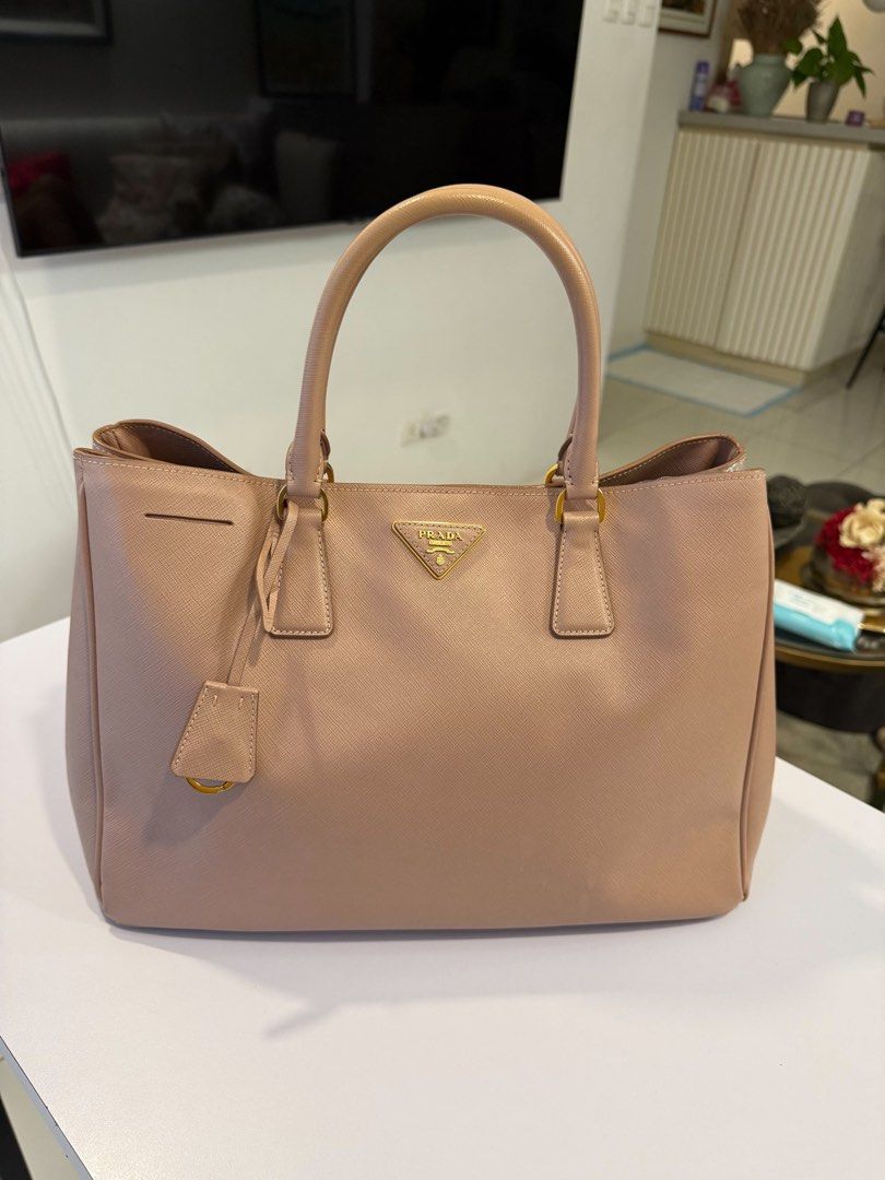 Bags (Category: Shoulder Bags) located in Balagtas. Submitted by renzopotz (Listing ID 1467171543, Image 3). Description: Luxury Pre-Loved Bags for Sale Giving these authentic designer beauties a new home. Carefully kept and still in great condition. Valentino Garavani Rockstud Double Handle Tote Bag ✔️ 100% Original ✔️ Includes dust bag and authenticity card ❌ No box Prada Saffiano Lux Galleria Double Zip Tote ✔️ 100% Original ✔️ Includes dust b