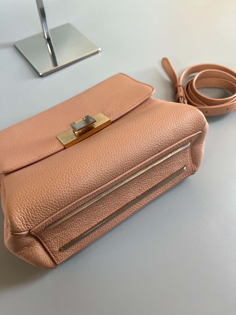 Balenciaga le dix authentic (Category: Luxury Bags & Wallets) located in Tacloban City. Submitted by luxbag_phhh (Listing ID 1467182793, Image 2). Description: Authentic balenciaga le dix pink pebbled leather shoulder bag. Features gold and silver twist lock hardware, detachable strap, and clean interior with a zip pocket. Includes authentication card. Perfect compact size for everyday use! Missing strap handle bilhan nyo nlang pero jan pa sling 