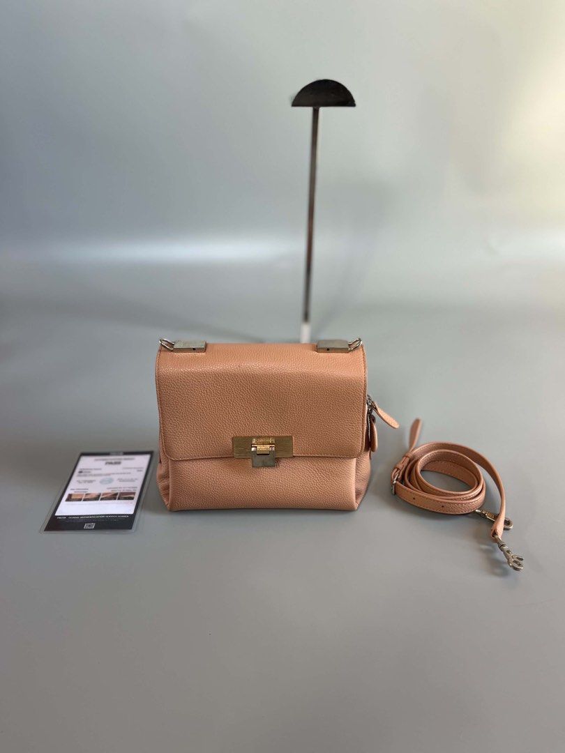 Balenciaga le dix authentic (Category: Luxury Bags & Wallets) located in Tacloban City. Submitted by luxbag_phhh (Listing ID 1467182793, Image 1). Description: Authentic balenciaga le dix pink pebbled leather shoulder bag. Features gold and silver twist lock hardware, detachable strap, and clean interior with a zip pocket. Includes authentication card. Perfect compact size for everyday use! Missing strap handle bilhan nyo nlang pero jan pa sling 