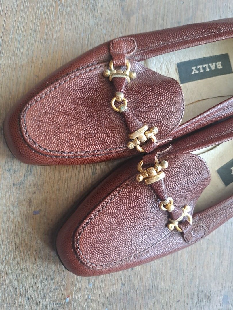 Bally Brown Leather Horsebit Loafers (Category: Loafers) located in Puerto Princesa. Submitted by jercksthriftph (Listing ID 1467362362, Image 3). Description: - Brand: Bally (Model: Eunice) - Style: Brown textured leather horsebit loafers with gold-tone hardware, slip-on design - Made in Italy - Size: 35.5 - Condition: Soles and heels in solid shape; light interior wear near seams - Perfect for work, casual chic, and everyday styling.