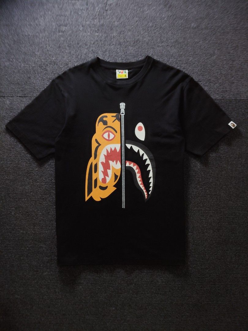 BAPE Black Tiger Shark Tee (Category: Tshirts & Polo Shirts ) located in Quezon City. Submitted by wgapparel (Listing ID 1467357298, Image 2). Description: 📌 available • Dimes: 19.5 x 27 W/L Medium on tag • Conditions: Excellent • Color Rate: 9.2 / better • Complete tags • Authentic 💯 • Issue: None Solid tiger shark 🦈🐅 Mine 2080 ( free shipping ) Location Quezon City Shipping via Lalamove or jnt No COD 💌 DM to purchase.