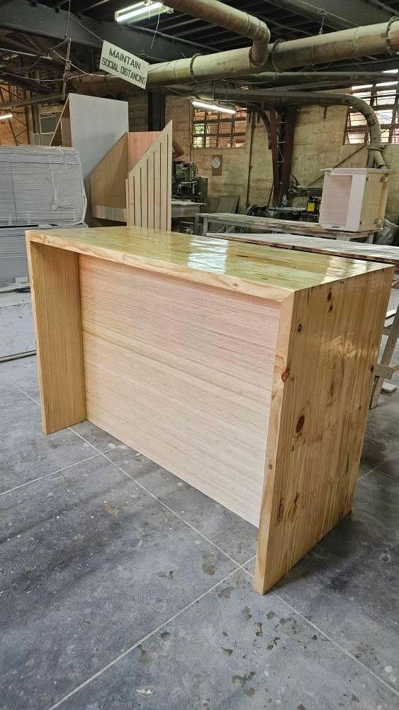 Bar Counter/Kitchen Counter with Storage Shelves (Category: Shelves, Cabinets & Racks) located in Quezon City. Submitted by hannietapa1001 (Listing ID 1467193093, Image 1). Description: Bar Counter/Kitchen Counter with Storage Shelves Materials: Palochina Wood Price: 6k (negotiable) Dimensions: Table itself - Width 70 cm - Length 140 cm - Height 100 (104 cm if with wheels. Added wheels to make it easier to move) Top shelf - Depth 35 cm - Height 4