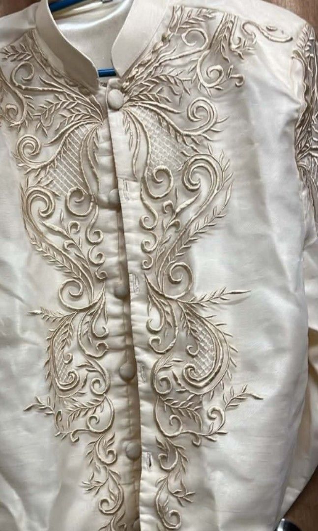 BARONG (Category: Formal Shirts) located in Adams. Submitted by liloandstitch18 (Listing ID 1467358712, Image 3). Description: FOR SALE BARONG W/ BROOCH LOCATION: Metro Manila / Dasma 📌 SIZE • Small–Medium • Recommended for 5'5"–5'8" • Around 65 – 80 kg Makapal For reference: 5’7” |55 kg Perfect for graduations, weddings, pictorials, and formal events. ✨ 📩 Message me for inquiries May Discount for sure buyer twice lang nagamit sa Grad pictorial