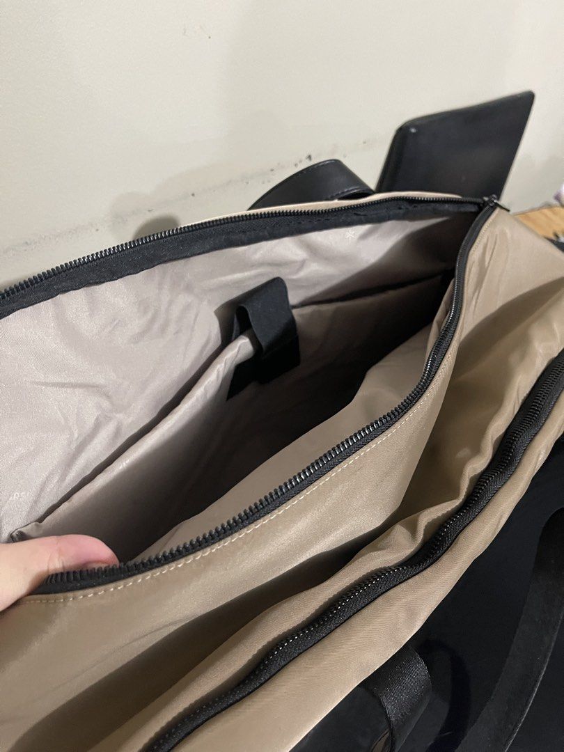BASH Gateway Weekender Large in Oak (Category: Shoulder Bags) located in Mandaluyong City. Submitted by jhoannamitzi (Listing ID 1467293574, Image 3). Description: - Brand/Model: Bask travel duffle bag - Color: Beige with dark brown sturdy carry handles - Storage: Front zip pocket with mesh pouch and dividers - Main Compartment: Opens flat with two large mesh zip sections - Tech-Friendly: Separate padded laptop section with strap closure - Condit