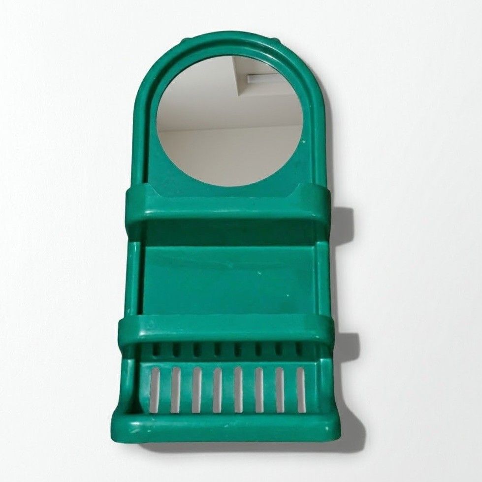 Bathroom Wall Mirror Rack (Category: Shelves, Cabinets & Racks) located in Quezon City. Submitted by reply_1982 (Listing ID 1467283142, Image 1). Description: - Color: Green - Features a built-in round mirror - 2 spacious middle shelves for toiletries and bottles - Bottom rack with slots for soap or small items - Dimensions: 53 cm (H) x 25.2 cm (W) x 11 cm (D).
