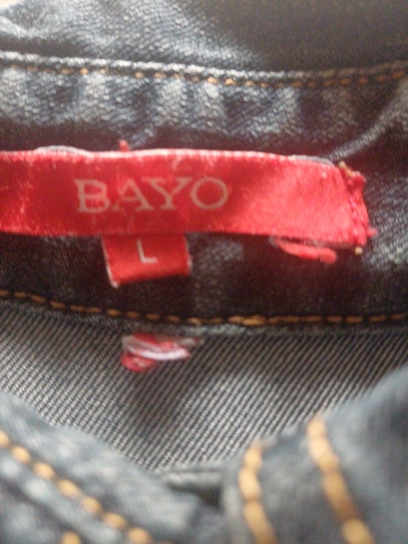 BAYO Denim Dress Size L (Category: Dresses) located in Quezon City. Submitted by happy_jeriboi (Listing ID 1467244838, Image 3). Description: - Brand: BAYO - Size: L (with tag attached) - Color: Dark denim / Classic blue jean with contrast stitching - Style: Shirt dress with button-up front and short sleeves - Features: Chest pockets and waist belt loops - Condition: Brand new with tag, easy casual everyday piece.