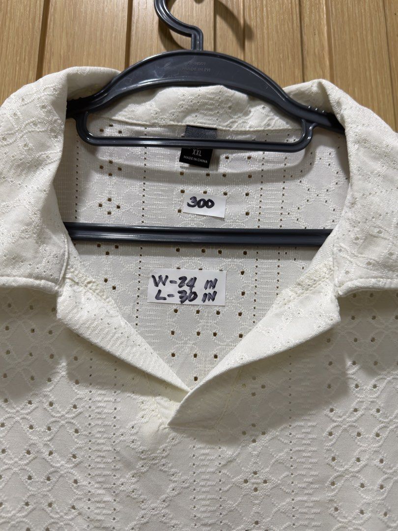 Beach White Pattern Polo Shirt for men XXL (Category: Tshirts & Polo Shirts ) located in Bacoor. Submitted by preloved_with_love_ (Listing ID 1467191817, Image 2). Description: - Color: White - Style: Short sleeve polo with open collar - Material: Textured knit with openwork patterns - Size: XXL (Width: 24", Length: 30") - Origin: Made in China.
