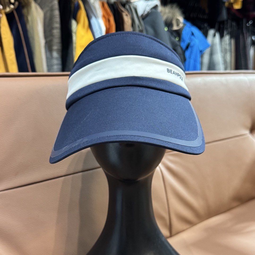 Beanpole Navy White Visor Hat (Category: Caps & Hats) located in Rizal. Submitted by houseofbell (Listing ID 1467355819, Image 2). Description: - Brand: Beanpole - Color: Navy blue and white with contrasting front band - Material: 100% polyester, lightweight and durable - Fit: Adjustable back strap for a comfortable, custom fit - Details: Features bold branding on the front and inner sweatband - Condition: Clean and ready to wear - Ideal for: Gol