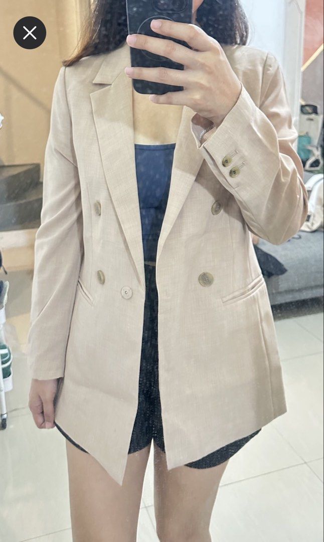 Beige Blazer Jacket (Category: Coats, Jackets and Outerwear) located in General Trias. Submitted by keiperry_ (Listing ID 1467286088, Image 1). Description: - Color: Neutral beige - Style: Single-breasted blazer with tortoise shell buttons Lightweight - Details: Notch lapel collar, front welt pockets, fully lined - Versatility: Easy to dress up for work or throw over casual tops.