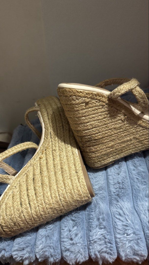 Beige jute platform wedge sandals size 37 (Category: Heels) located in Manila. Submitted by darslovesfoods (Listing ID 1467188378, Image 2). Description: - Style: Strappy espadrille wedge sandals with open toe - Color: Neutral beige and cream - Size: EU 37 - Features: Rope-wrapped platform heel and comfortable insoles - Condition: Excellent, minimal wear on bottom tread - Perfect go-to footwear for summer outfits and vacations.