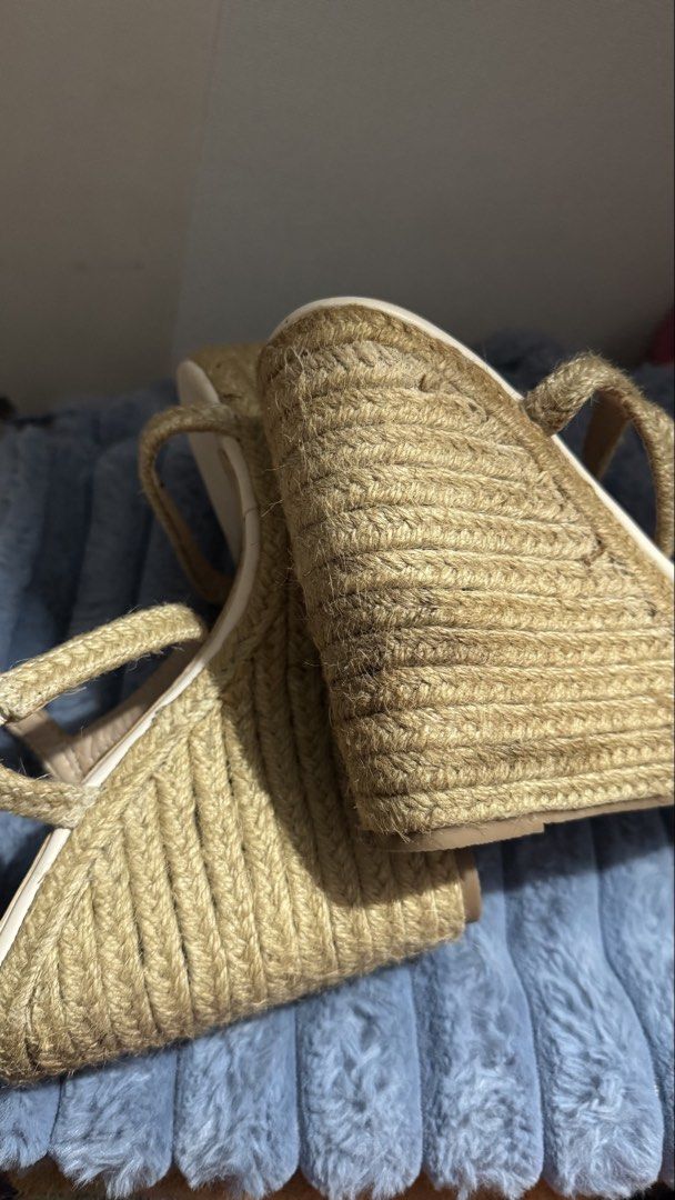 Beige jute platform wedge sandals size 37 (Category: Heels) located in Manila. Submitted by darslovesfoods (Listing ID 1467188378, Image 3). Description: - Style: Strappy espadrille wedge sandals with open toe - Color: Neutral beige and cream - Size: EU 37 - Features: Rope-wrapped platform heel and comfortable insoles - Condition: Excellent, minimal wear on bottom tread - Perfect go-to footwear for summer outfits and vacations.