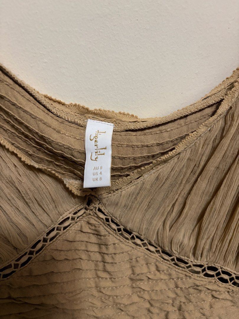 Beige Long Sleeve Crop Top (Category: Longsleeves) located in Quezon City. Submitted by j.steffy (Listing ID 1467320271, Image 2). Description: - Brand: Tigerlily - Size: AU 8 / US 4 / UK 8 - Color: Neutral beige - Neckline: Square neck with delicate lace trim - Material/Texture: Crinkled chiffon with horizontal pintucks - Closure: Hidden side zipper.