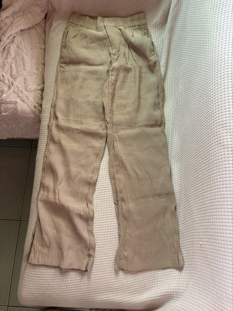 Beige Trousers Size S (Category: Other Bottoms) located in Manila. Submitted by amilannnn (Listing ID 1467198182, Image 1). Description: - Brand: niftyfourtwenty - Size: S - Color: Beige - Fit: Relaxed straight leg - Waistband: Elastic at the back with front zipper and hook-and-eye closure - Fabric: Light and breathable, perfect for casual days or office wear - Condition: Barely worn, excellent shape - Lightweight and comfortable.