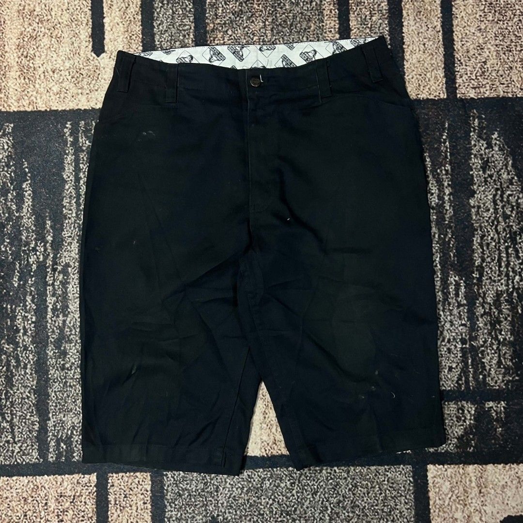 Ben Davis Black Work Shorts (Category: Shorts) located in Cebu City. Submitted by royalwolf-2a85 (Listing ID 1467309659, Image 2). Description: - Brand: Ben Davis - Color: Classic Black - Material: Heavy-duty twill fabric - Details: Iconic monkey logo patch on back pocket, branded metal hardware, and custom printed inner waistband lining - Condition/Use: Built tough for everyday wear or skate sessions - Versatility: Clean colorway that easily mat