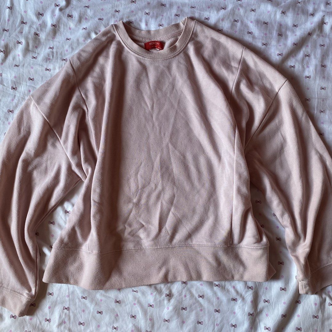 Bench Pink Crewneck Sweatshirt Medium (Category: Coats, Jackets and Outerwear) located in Abulug. Submitted by dear_darlingdoll (Listing ID 1467357849, Image 1). Description: - Brand: Bench (Manufactured by Suyen Corporation) - Color: Soft Pink - Size: Medium (Relaxed fit with dropped shoulders) - Style: Classic pullover crewneck with ribbed cuffs, hem, and neckline - Condition: Red collar tag and interior care label intact.