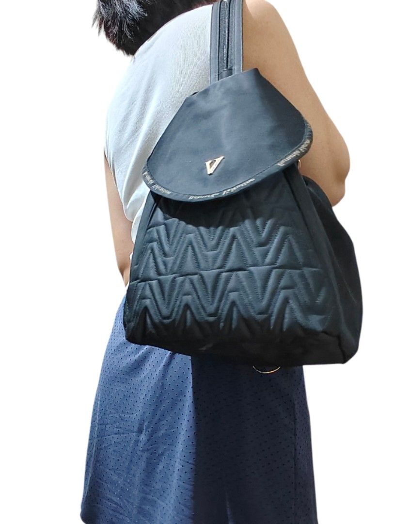 Bernardo Valentino 3-way Black Quilted Bag (Category: Backpacks) located in Munoz. Submitted by harm0nica337 (Listing ID 1467190726, Image 1). Description: - Brand: Bernardo Valentino - Color: Classic Black - Design: Flap closure with gold-tone V logo, quilted chevron lower half, and stylish side zippers - Features: Adjustable straps and clean fabric interior/exterior - Versatility: Perfect size for daily use, school, or weekend getaways - Condit