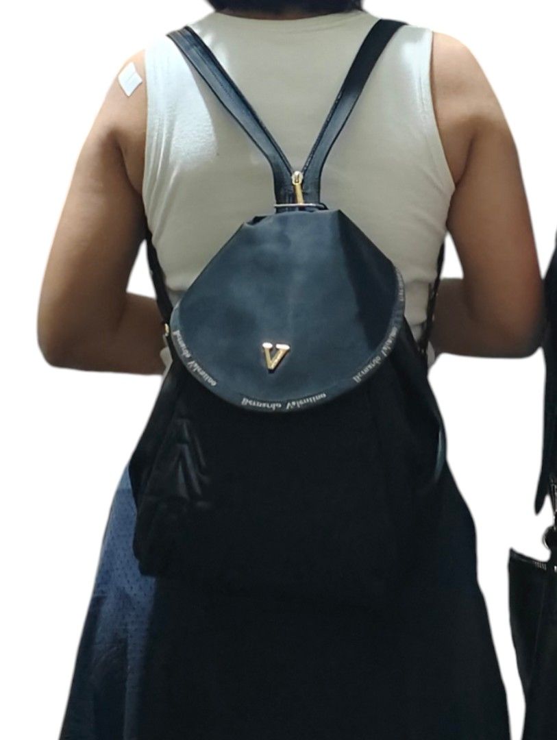 Bernardo Valentino 3-way Black Quilted Bag (Category: Backpacks) located in Munoz. Submitted by harm0nica337 (Listing ID 1467190726, Image 3). Description: - Brand: Bernardo Valentino - Color: Classic Black - Design: Flap closure with gold-tone V logo, quilted chevron lower half, and stylish side zippers - Features: Adjustable straps and clean fabric interior/exterior - Versatility: Perfect size for daily use, school, or weekend getaways - Condit
