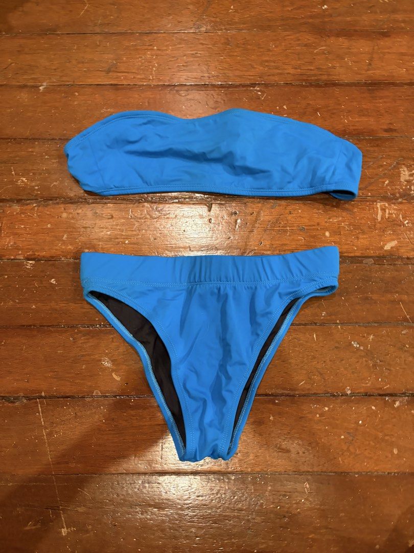 Beyond the beach Two-Piece Bandeau Bikini Set (Category: Bikinis & Swimsuits) located in Makati City. Submitted by margaaa01 (Listing ID 1467313227, Image 1). Description: - Color: Vibrant blue - Style: Two-piece bandeau and high-waisted swimsuit - Top: Strapless cut - Bottoms: Comfortable elastic waistband - Lining: Fully lined interior in black - Condition: Clean, well-maintained, and ready for summer.