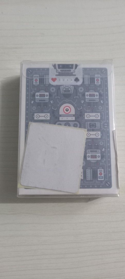 Bicycle Robot Factory Edition Playing Cards (Category: Board Games & Puzzles) located in Pasig City. Submitted by j-fri0127 (Listing ID 1467175758, Image 2). Description: - Brand: Bicycle Robot Factory Edition - Condition: Brand new, factory sealed in original plastic with a clear protective case - Design: Intricate grey and blue mechanical robot graphics - Size: Standard poker size - Ideal for: Card games, magic tricks, and cardistry collections