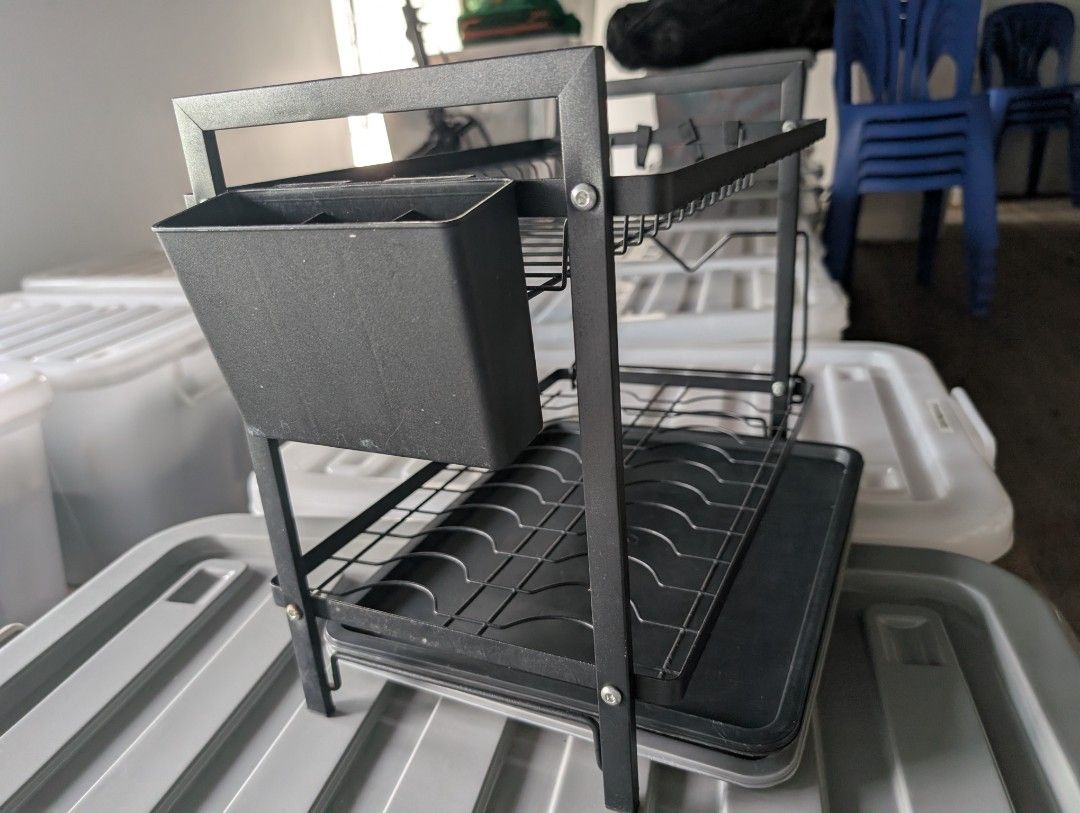 Black 2-Tier Dish Drying Rack with Utensil Holder (Category: Food Organization & Storage) located in Manila. Submitted by coolshark888 (Listing ID 1467326558, Image 3). Description: - Two-tier metal dish drying rack in a sleek black finish - Includes a bottom plastic drainage tray to keep counters dry - Hanging cutlery holder and built-in hooks for extra storage - Sturdy wire frame holds plates securely upright on both levels - Clean and ready fo