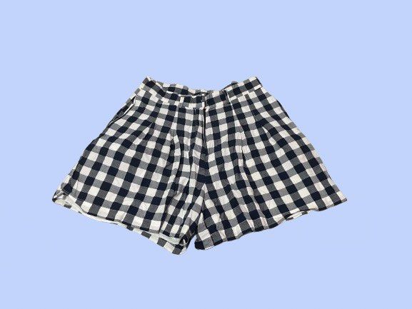 Black and White Gingham Pleated Shorts (Category: Shorts) located in Manila. Submitted by joclutter (Listing ID 1467317502, Image 1). Description: - Pattern: Classic black and white gingham - Fit: High-waisted with front pleats and belt loops - Closure: Secure zip fly with clasp - Interior: Fully lined for comfort - Fabric: Lightweight, ideal for warm weather - Quality: Clean hems and neat stitching throughout.