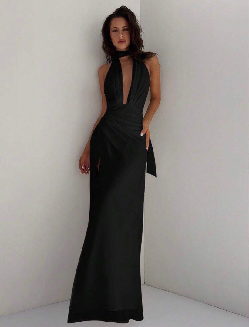 Black Halter Neck Slit Maxi Dress (Category: Dresses) located in Manila. Submitted by renkacoleni (Listing ID 1467222079, Image 1). Description: - Style: Black maxi dress with deep V-neck and halter strap - Details: Draped front waist and high thigh slit on the right leg - Material: Sleek satin-like fabric - Condition: Worn once, freshly dry-cleaned, and ready to wear - Perfect for: Evening outs, parties, and formal events.