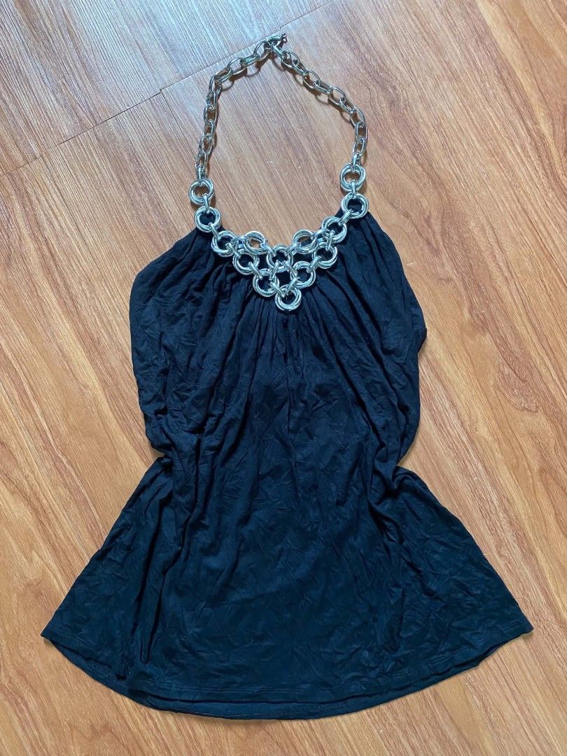 Black Halter Top with Silver Chain Neck Detail (Category: Sleeveless) located in Malasiqui. Submitted by finnley26 (Listing ID 1467246722, Image 1). Description: - Color: Black - Style: Sleeveless halter top with built-in chunky silver chain and ring hardware - Fabric: Soft textured material with a gathered, draped front - Fit: Flared hemline, easy to style - Occasion: Perfect for parties and nights out (pairs great with jeans or a skirt) - Condi