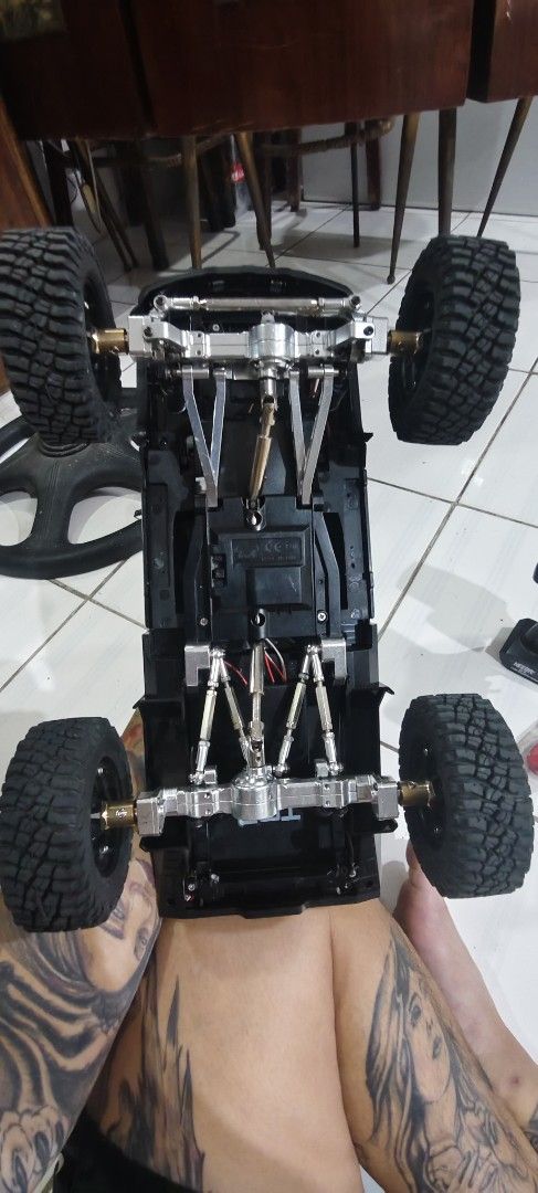 Black Land Cruiser RC Crawler 7CH Transmitter (Category: Remote Control Toys) located in Las Pinas. Submitted by jonjaymanese20 (Listing ID 1467247114, Image 3). Description: - Ready-to-run black Land Cruiser RC crawler truck - Includes 7-channel Neebrk remote controller and battery - Features durable metal links and axles underneath - Equipped with chunky off-road tires and scale details - Comes with extra metal upgrade parts, including a red ge