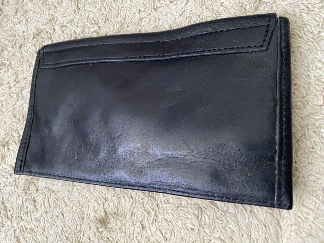 Black Leather Twist Lock Wallet Pouch (Category: Wallets & Card holders) located in Baguio. Submitted by SweetRepeat (Listing ID 1467193097, Image 2). Description: - Color/Material: Black leather with raw suede interior lining - Closure: Elegant gold twist lock on the front flap - Fit: Slim profile that easily fits a standard smartphone and daily essentials - Condition: Minor wear on the leather surface from previous handling - Style: Compact, ve