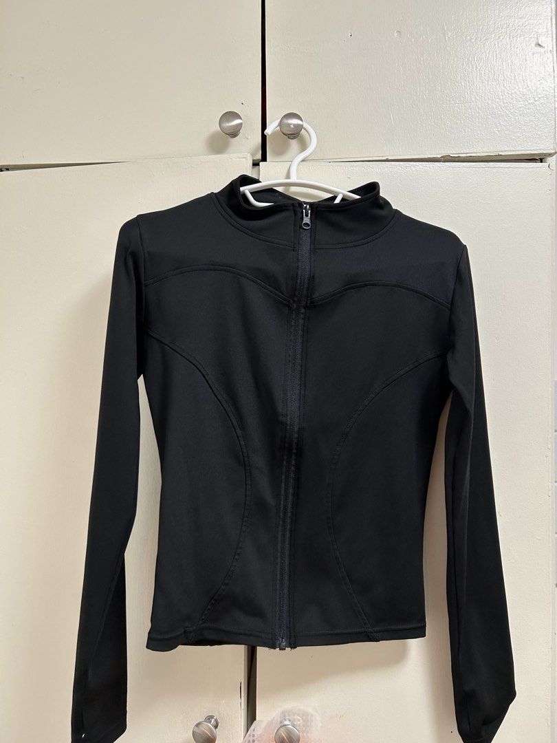 Black Long-Sleeve Zip-Up Athletic Jacket (Category: Coats, Jackets and Outerwear) located in Pateros City. Submitted by safewind_85fc6d (Listing ID 1467324093, Image 1). Description: - Color: Solid black - Material: Smooth, high-performance fabric - Design: Front zipper with a stand-up collar - Fit: Fitted style with curved panel seams for a flattering silhouette - Sleeves: Long sleeves - Versatility: Ideal for workouts, runs, or casual everyday 