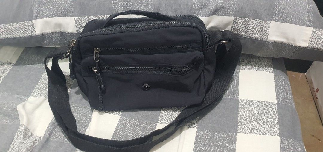 Black Nylon Multi-Zip Crossbody Bag (Category: Cross-body Bags) located in Paranaque City. Submitted by personal_preloved40 (Listing ID 1467260556, Image 1). Description: - Material: Durable black nylon - Strap: Adjustable for easy carrying - Storage: Multiple zippered compartments with a secure inner zip pocket - Interior: Solid black lining, very clean - Hardware: Sturdy, smooth-working zippers Has minimal issue handle need to be stitched see 8