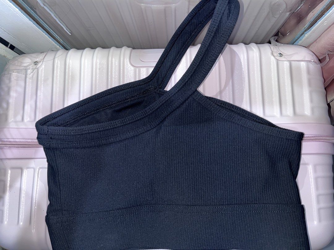 Black One-Shoulder Ribbed Active Crop Top Size S (Category: Sleeveless) located in Muntinlupa City. Submitted by zabbri (Listing ID 1467296257, Image 2). Description: - Style: Trendy one-shoulder ribbed crop top in classic black - Support: Features a thick, secure underband - Size: 8 / Small - Material: 78% nylon, 22% elastane (stretchable and comfortable).