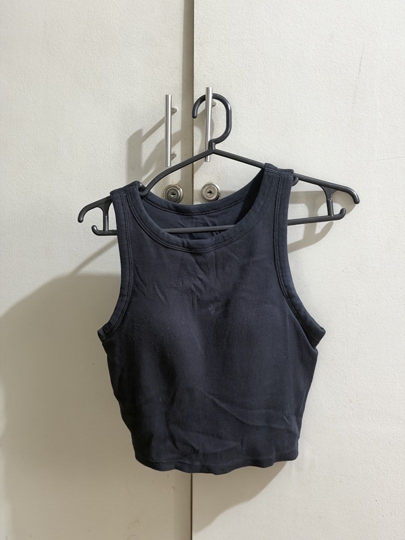 Black ribbed crop top tank top basic top (Category: Sleeveless) located in Manila. Submitted by karely (Listing ID 1467241962, Image 1). Description: - Color: Classic black - Style: Cropped length, high neckline, wide shoulder straps - Material: Stretchy, super comfortable fabric - Versatility: Perfect for daily wear or workouts, matches with anything.