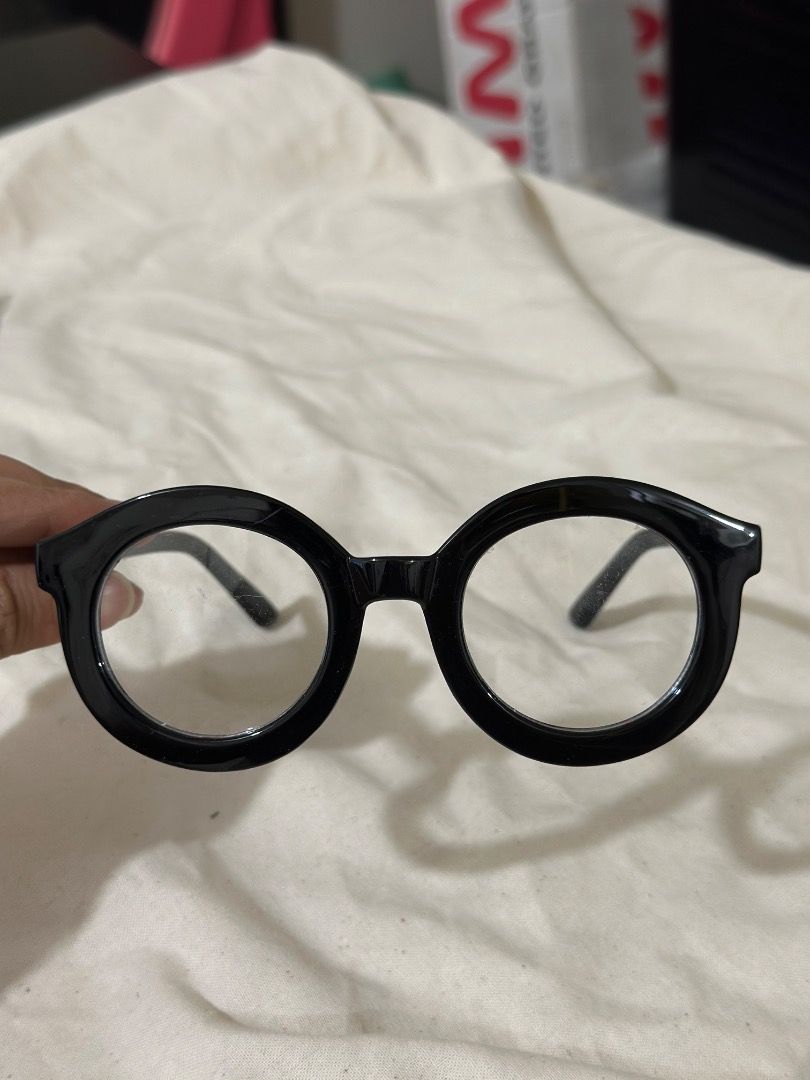 Black Round Frame Glasses Chunky Retro Eyewear (Category: Sunglasses & Eyewear) located in Mandaluyong City. Submitted by lovedbyjaaaam (Listing ID 1467279684, Image 2). Description: - Chunky black frames with a trendy circular round shape - Fitted with clear, non-prescription lenses - Stylish glossy finish on durable plastic material - Lightweight and comfortable for all-day wear - Perfect statement piece to elevate any outfit.