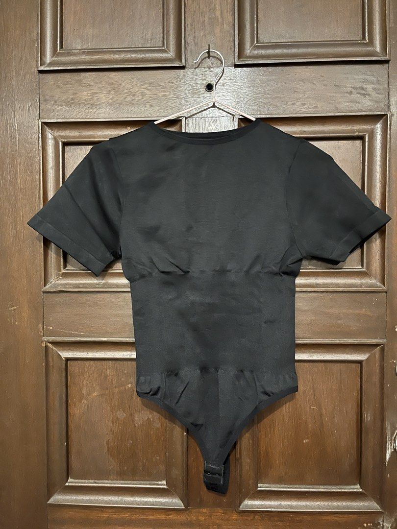 Black Shapewear Bodysuit (Category: Blouses) located in Makati City. Submitted by yoursecondbest (Listing ID 1467255063, Image 1). Description: - Color: Black - Style: Short sleeve bodysuit with built-in waist and midsection shaping panels - Fabric: Stretchy, seamless knit construction - Closure: Bottom snap closure.