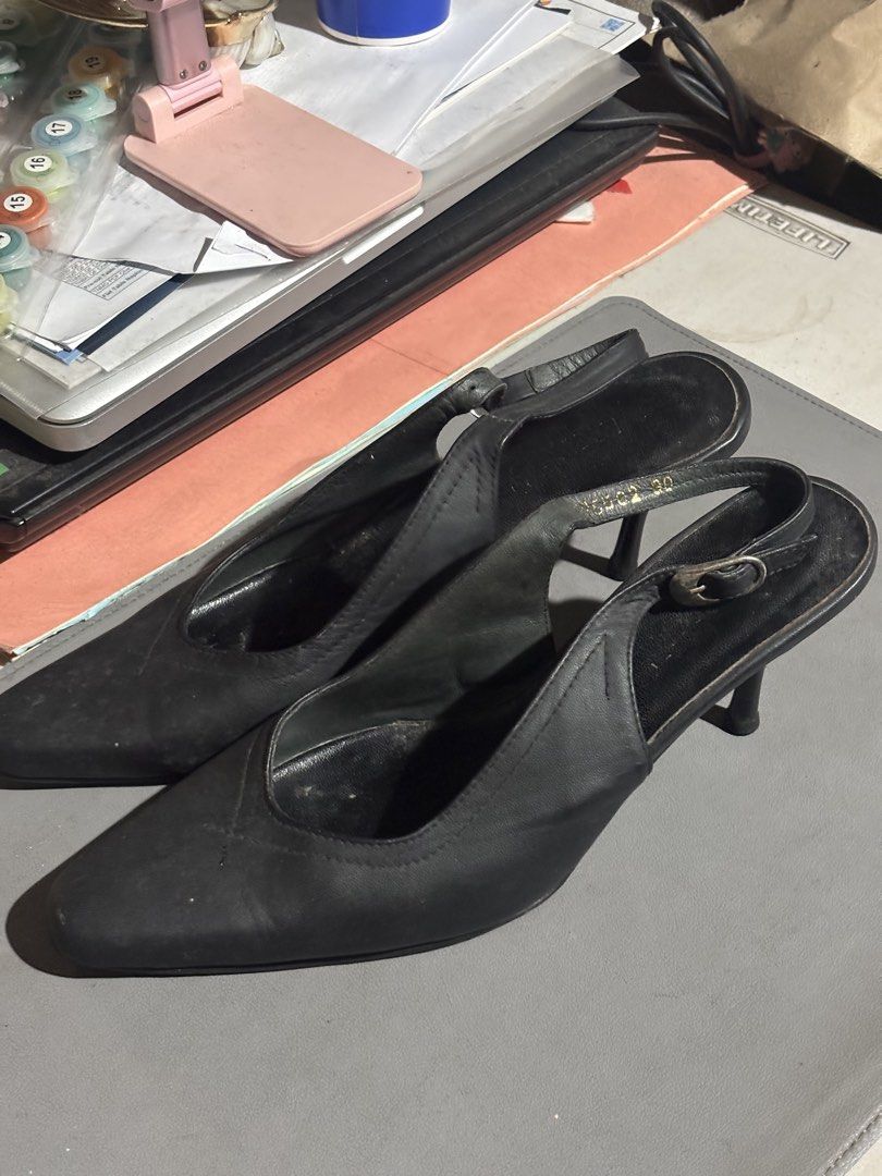 Black slingback kitten heels pointed toe size 39 (Category: Heels) located in Manila. Submitted by andyunchal28661 (Listing ID 1467327022, Image 2). Description: - Color: Black - Material: Leather - Style: Slingback kitten heels with pointed toe and stiletto heel - Features: Adjustable buckle strap, stamped serial code inside strap - Condition: Worn condition with some wear on soles and leather surface - Versatility: Classic design perfect for wo