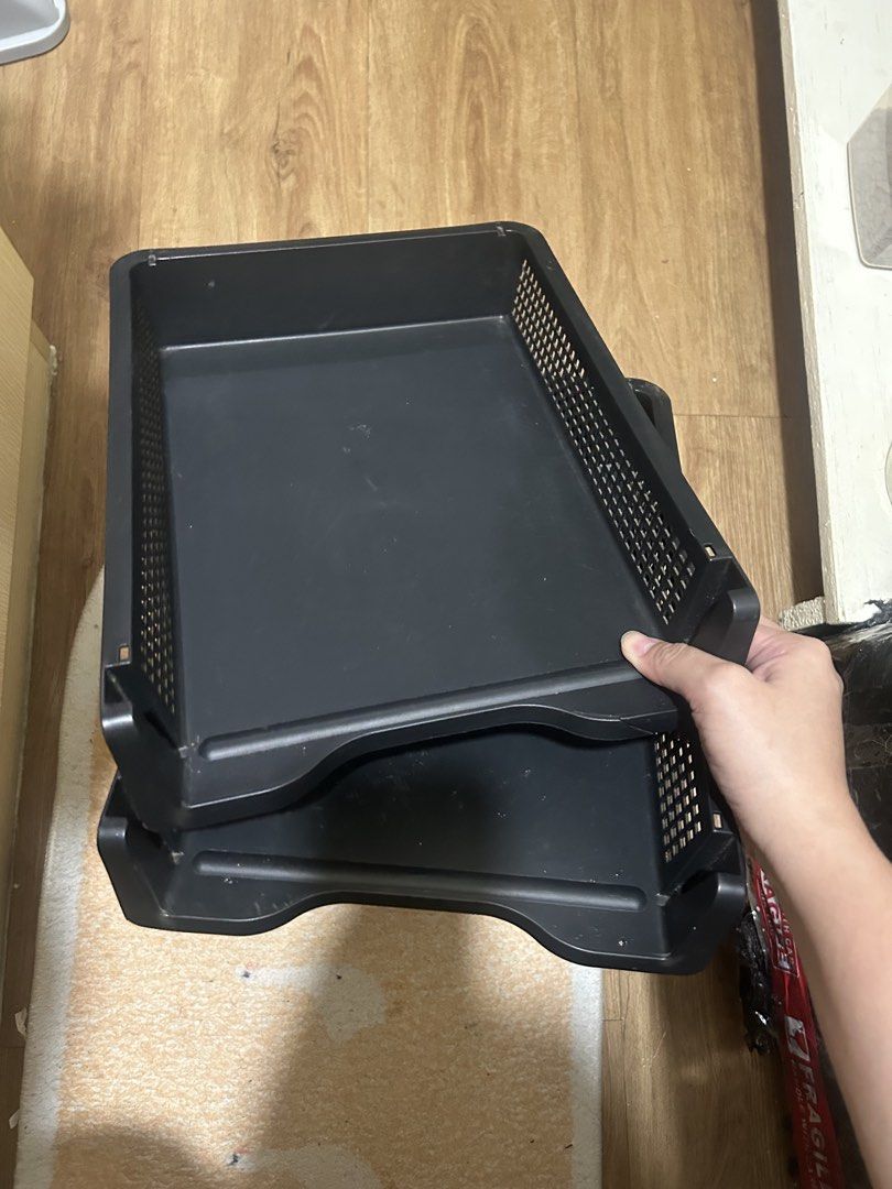 Black Stackable Desk Document Trays (Category: Office Furniture & Fixtures) located in Quezon City. Submitted by fastocean.cf0f25 (Listing ID 1467355412, Image 1). Description: - Set of 2 stackable black plastic desk trays - Durable mesh grid pattern on sides and back - Ideal for organizing paperwork, folders, and mail - Sturdy build that is easy to stack and unstack - Standard desktop size with normal signs of use.